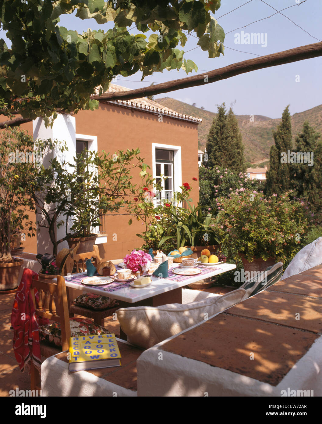 Table set for lunch on terrace of villa in southern Spain Stock Photo
