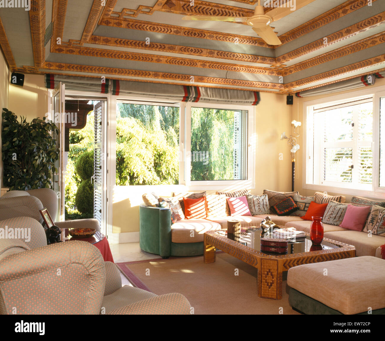 Ornate Ceiling In Spanish Living Room With Colorful Cushions