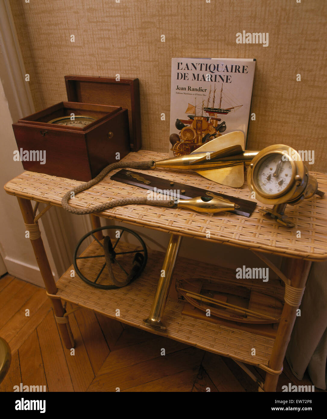 Collection of nautical artefacts on woven bamboo table Stock Photo