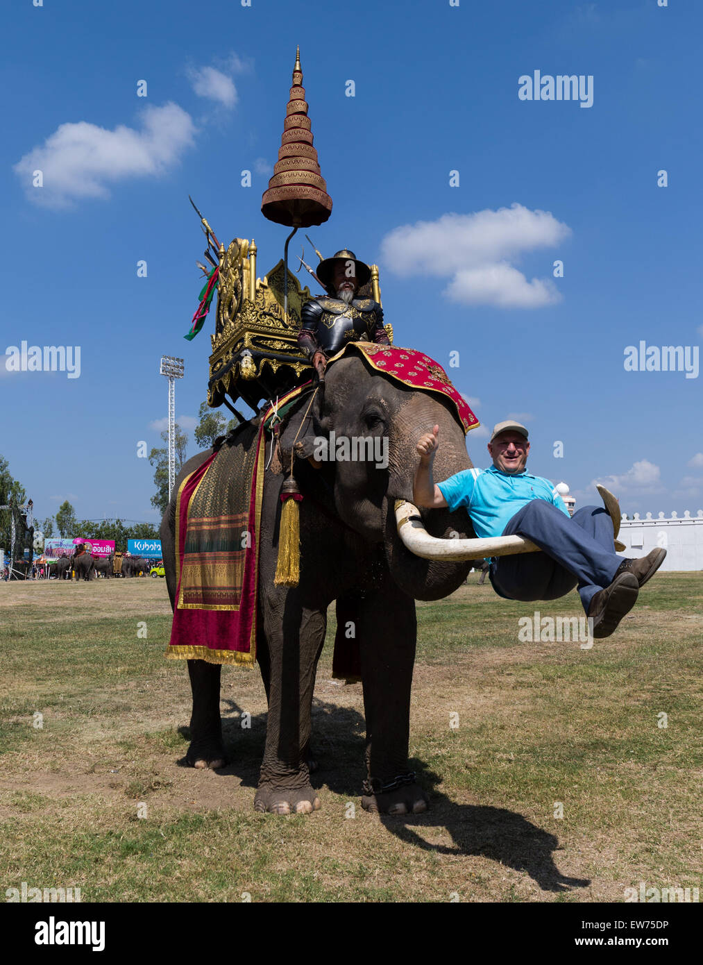 BANGKOK, THAILAND: Tourists wearing elephant-adorned trousers order food at  a stall on Khao San Road in Bangkok, Thailand on August 22nd, 2019.  Bangkok's bustling Khao San Road - a strip famous among