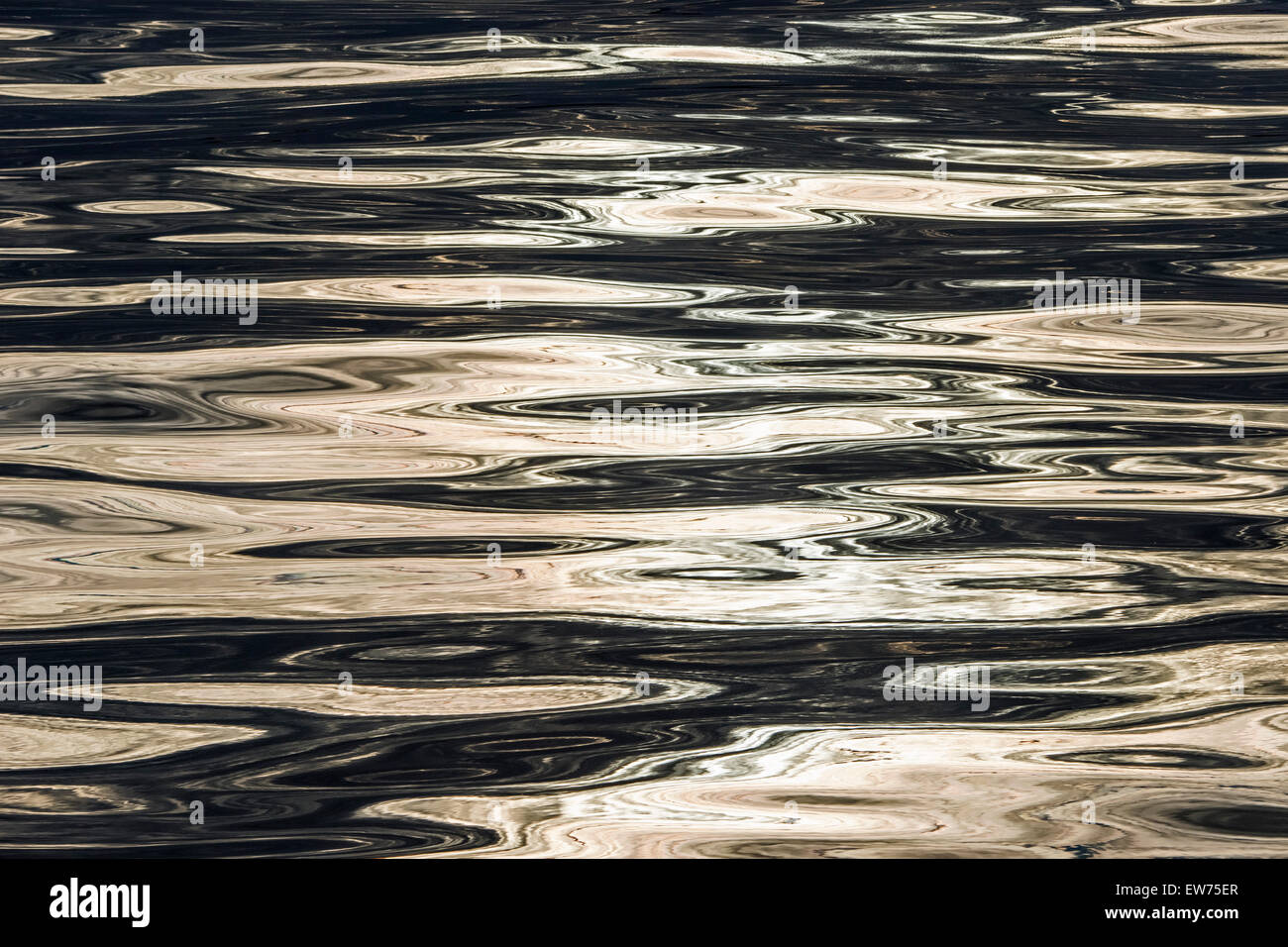Evening sky and sun reflected on the surface of the sea, Denmark Strait, Greenland Stock Photo
