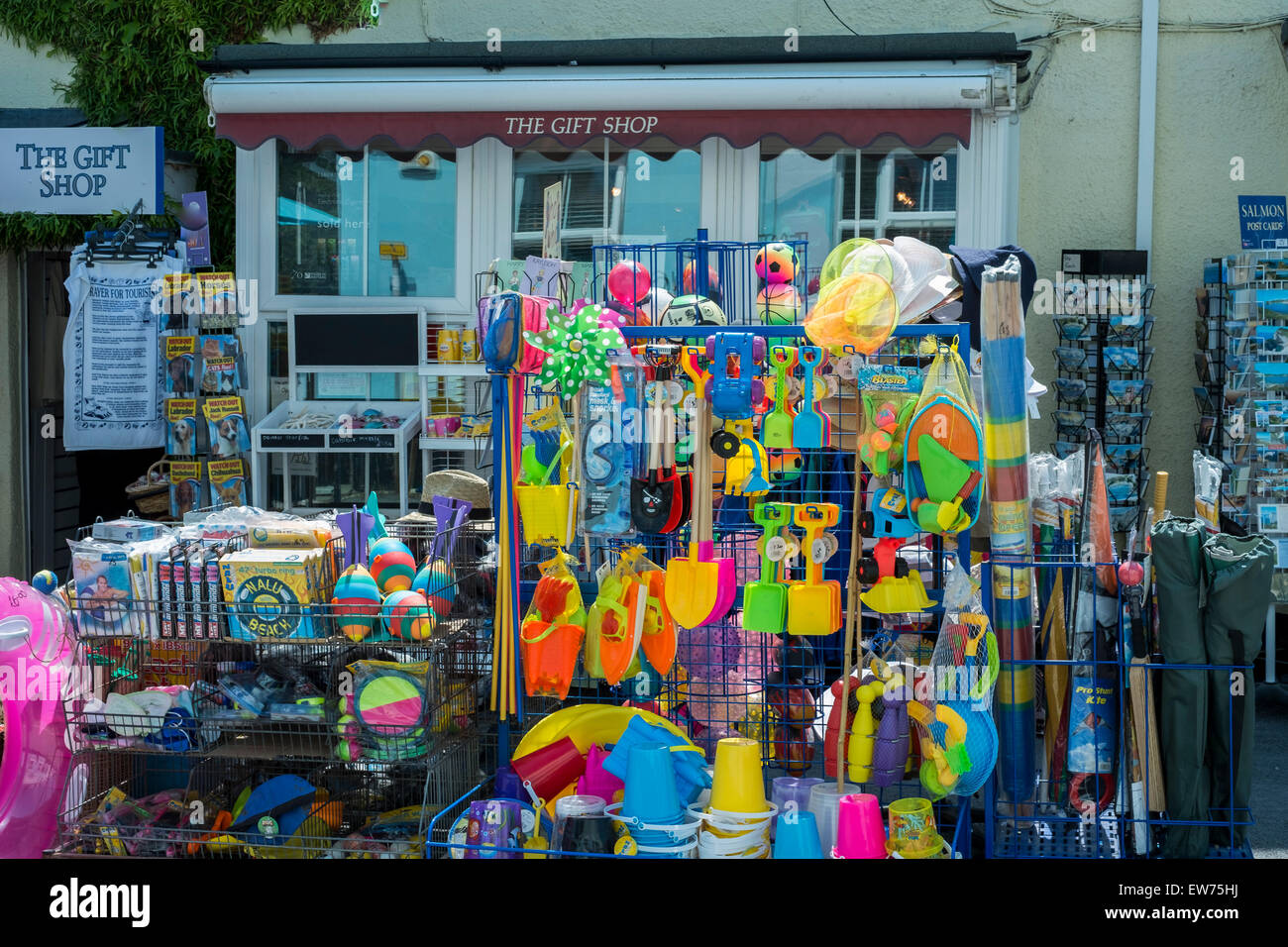 Colourful gift shop selling buckets and spade in Lulworth Cove Dorset