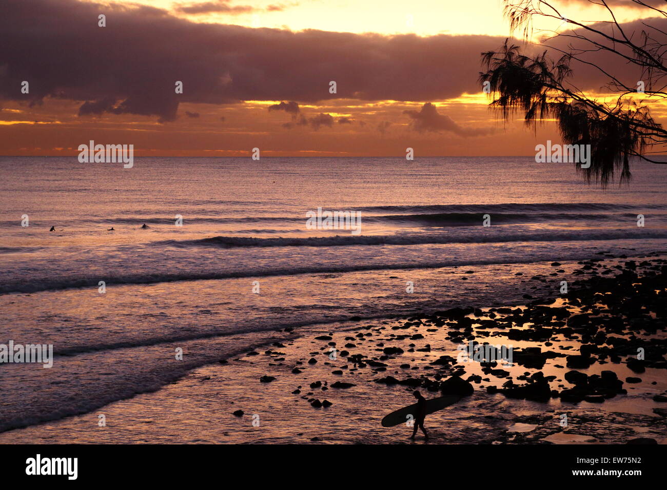 Dawn caresses the Pacific Ocean and surfers off Alexandra Headland on the Sunshine Coast, Queensland, Australia. Stock Photo