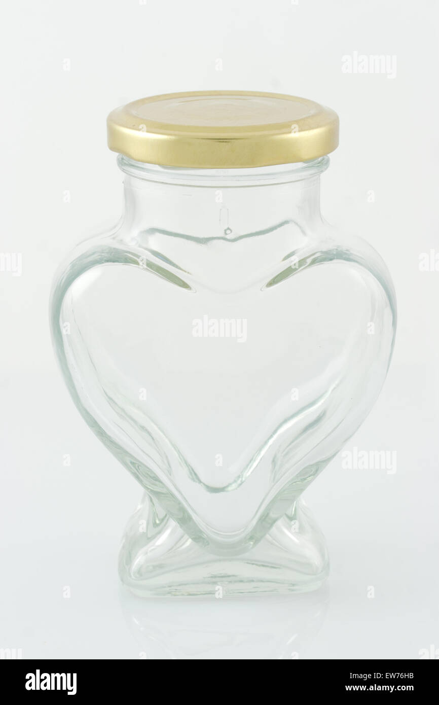 Closed lid transparent empty glass heartshaped mason jar isolated in