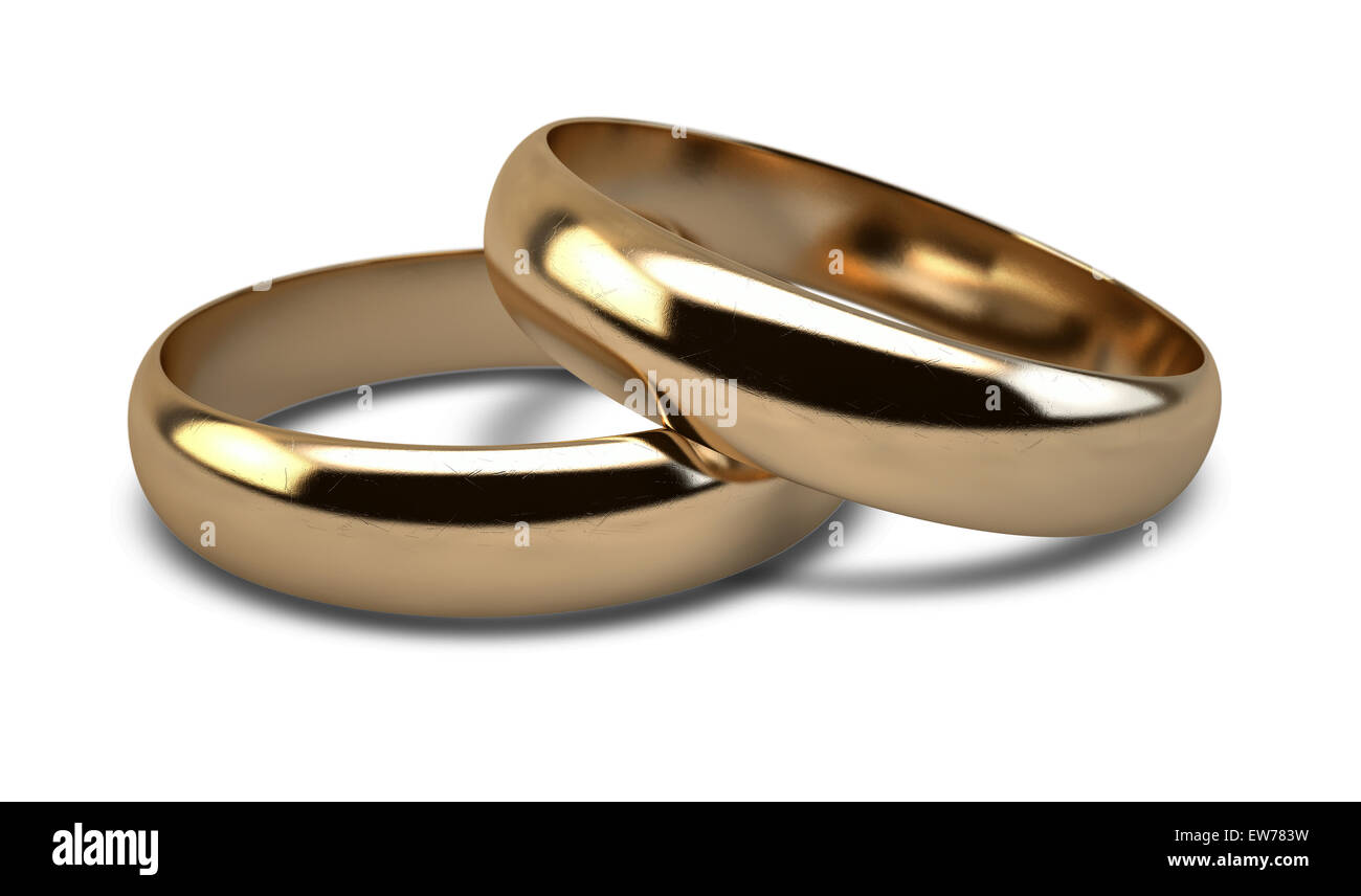 A pair of gold wedding rings resting on an isolated white background ...