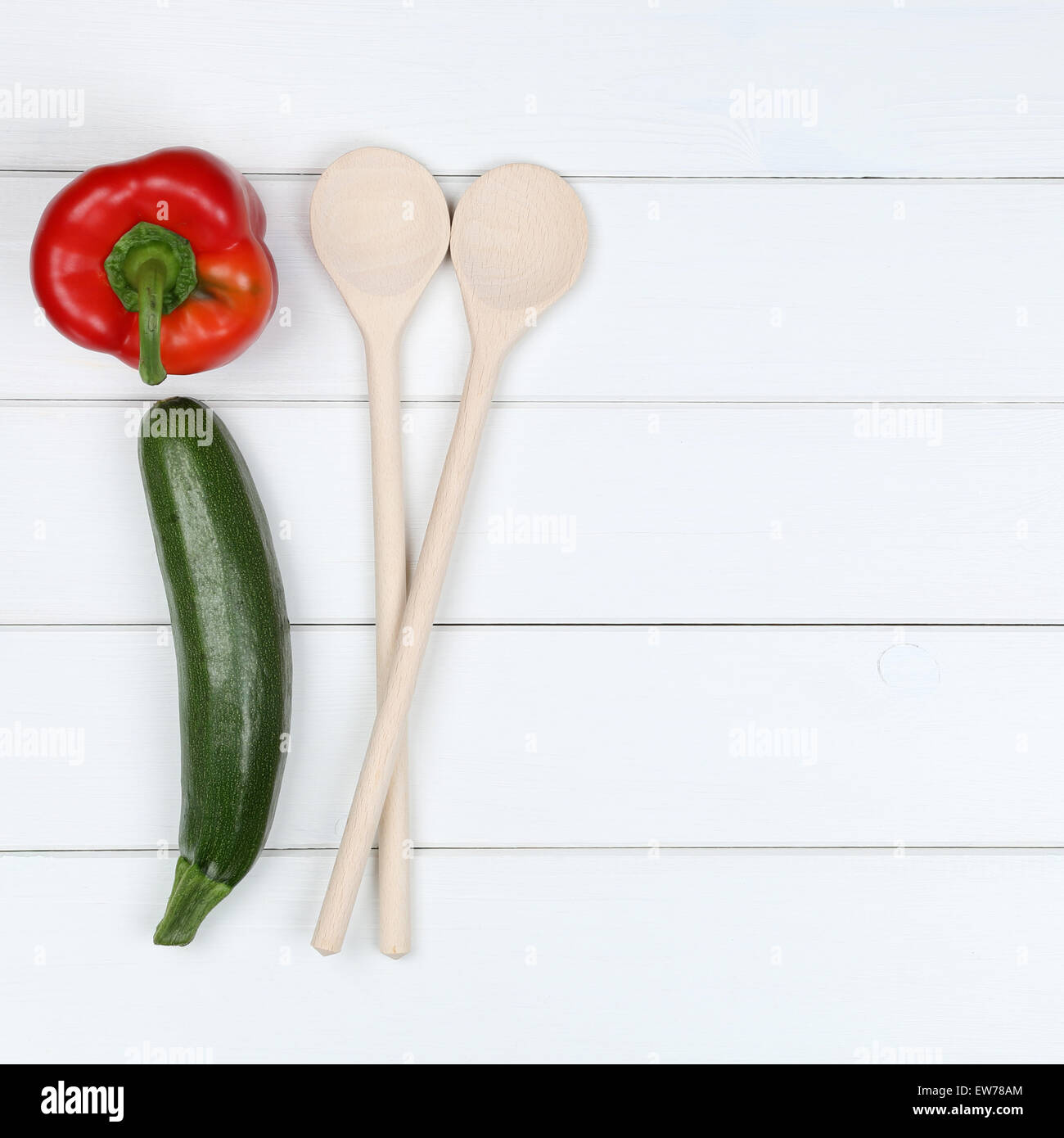 Healthy cooking with vegan vegetarian vegetables ingredients and copyspace on a wooden board Stock Photo