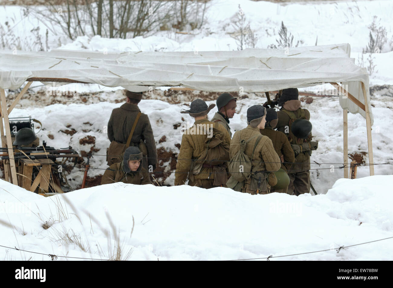 RUSSIA, LIZLOVO - DECEMBER 14: Unidentified soldiers hide under the tent on reenactment of the counterattack under the Moscow in 1941 in World War II, in Moscow region, Lizlovo village, Russia, 2014 Stock Photo