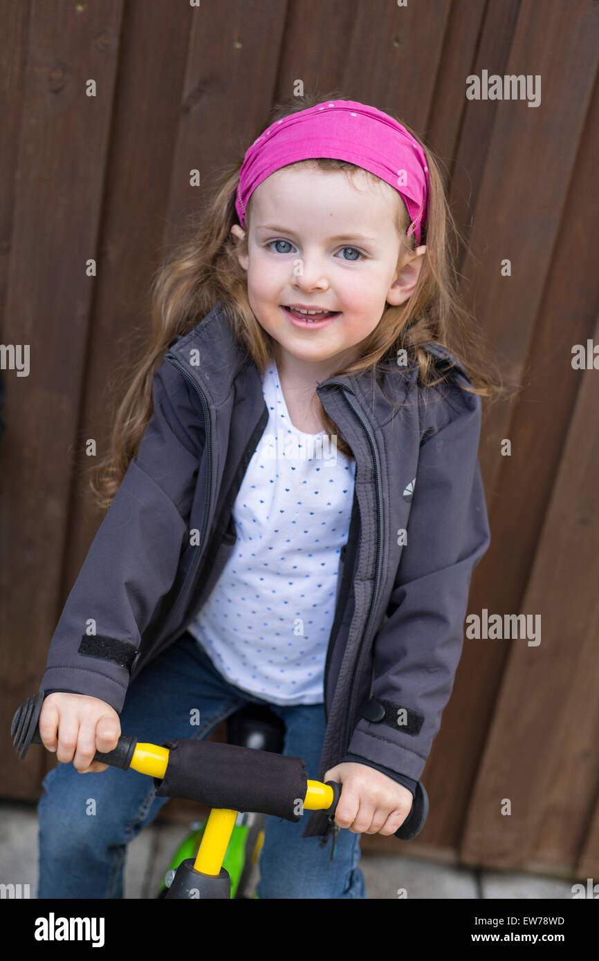Little girl with balance bike Stock Photo Alamy