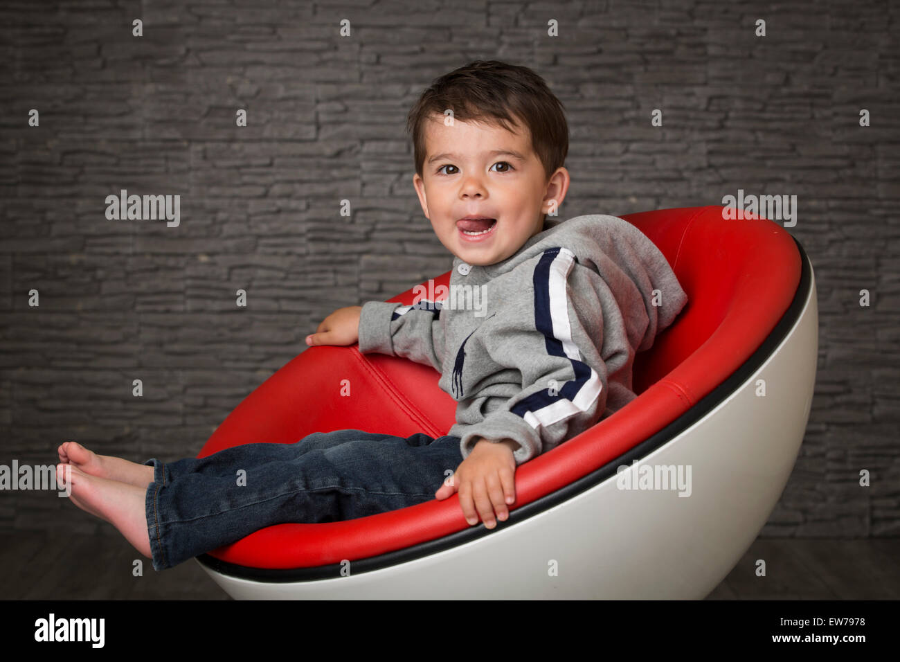 Indian boy sitting chair barefoot hi-res stock photography and images ...