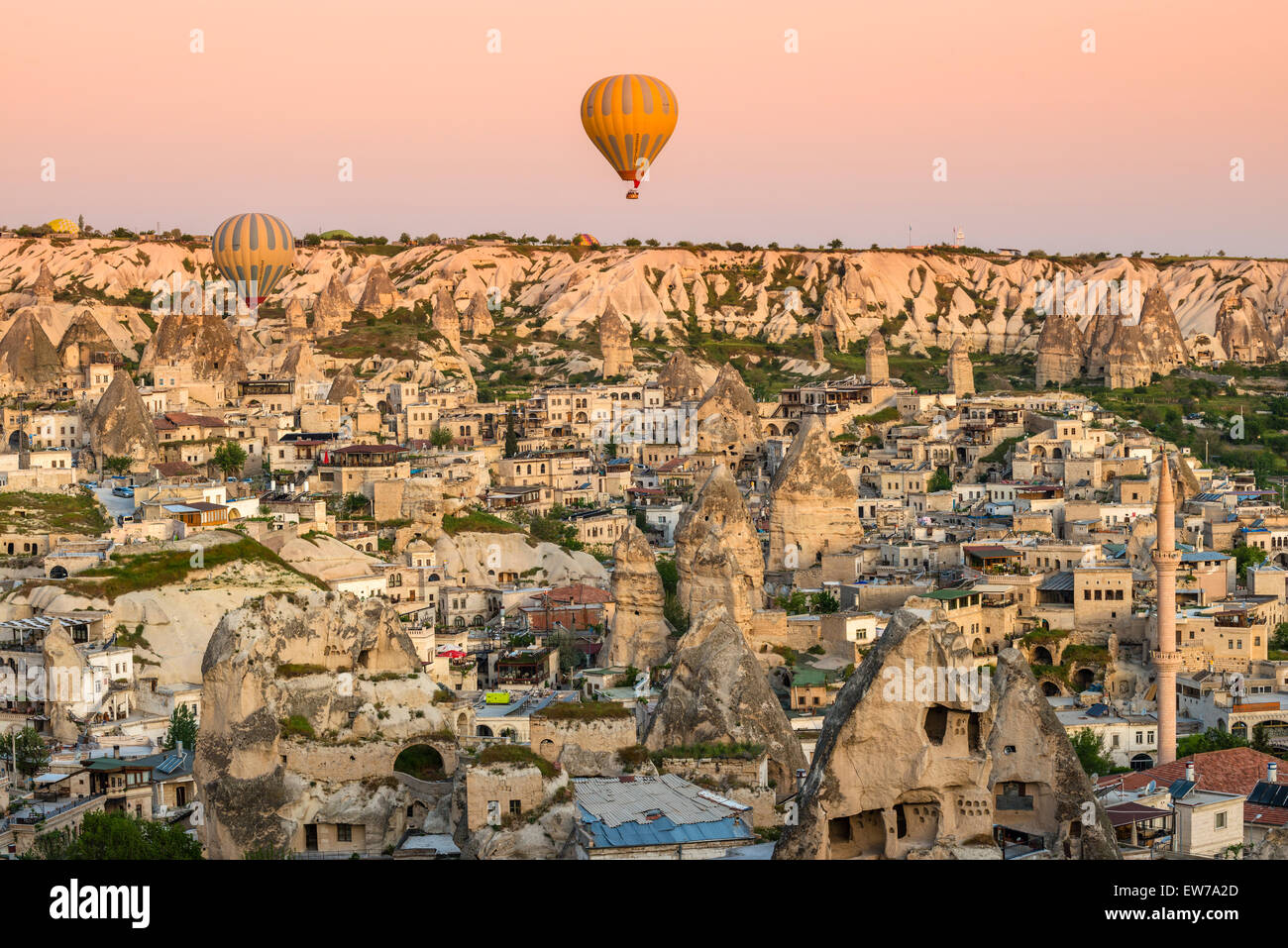 Top view of Goreme with hot air balloons at sunrise, Cappadocia, Turkey Stock Photo