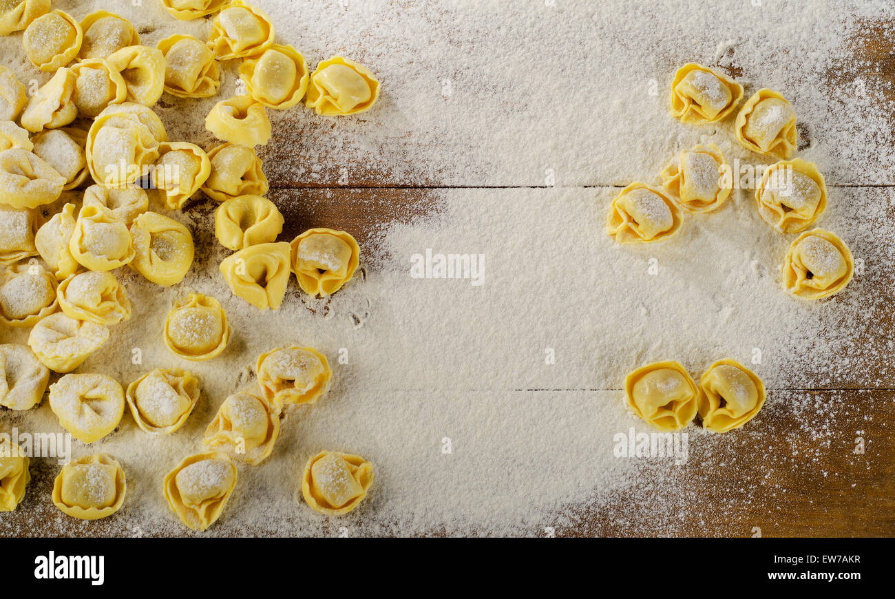 Freshly Made Ravioli on  wooden table. Top view Stock Photo