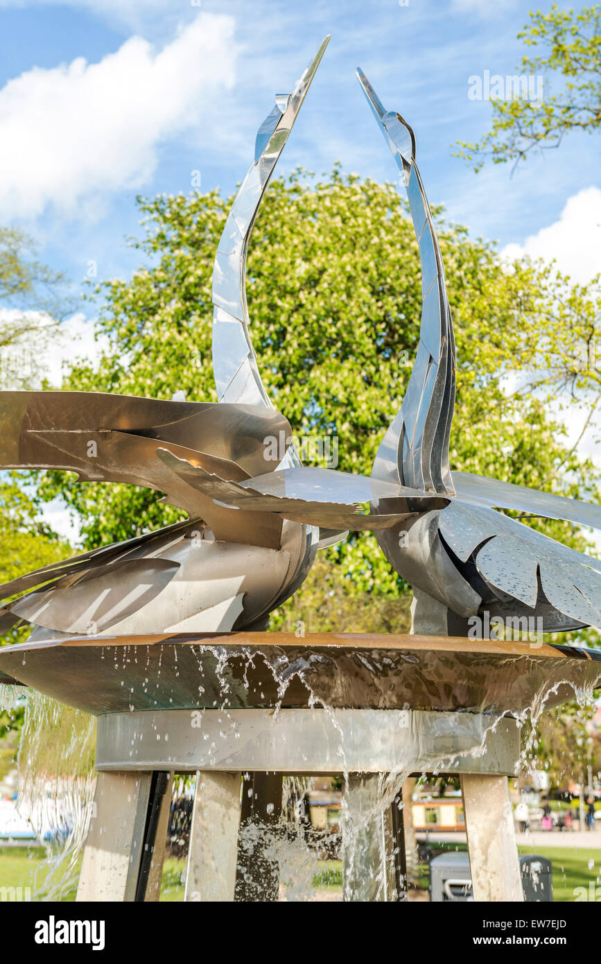 Outside the Swan Theatre in Stratford upon Avon is a sculpture of two swans Stock Photo