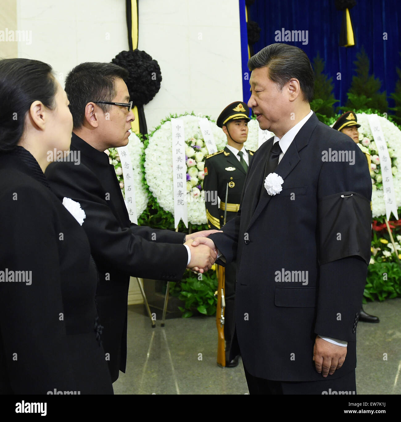 Beijing, China. 19th June, 2015. Chinese President Xi Jinping (R) shakes hands with a family member of Qiao Shi, former chairman of the National People's Congress (NPC) Standing Committee, while attending Qiao's funeral in Beijing, capital of China, June 19, 2015. Qiao Shi was cremated Friday. © Rao Aimin/Xinhua/Alamy Live News Stock Photo