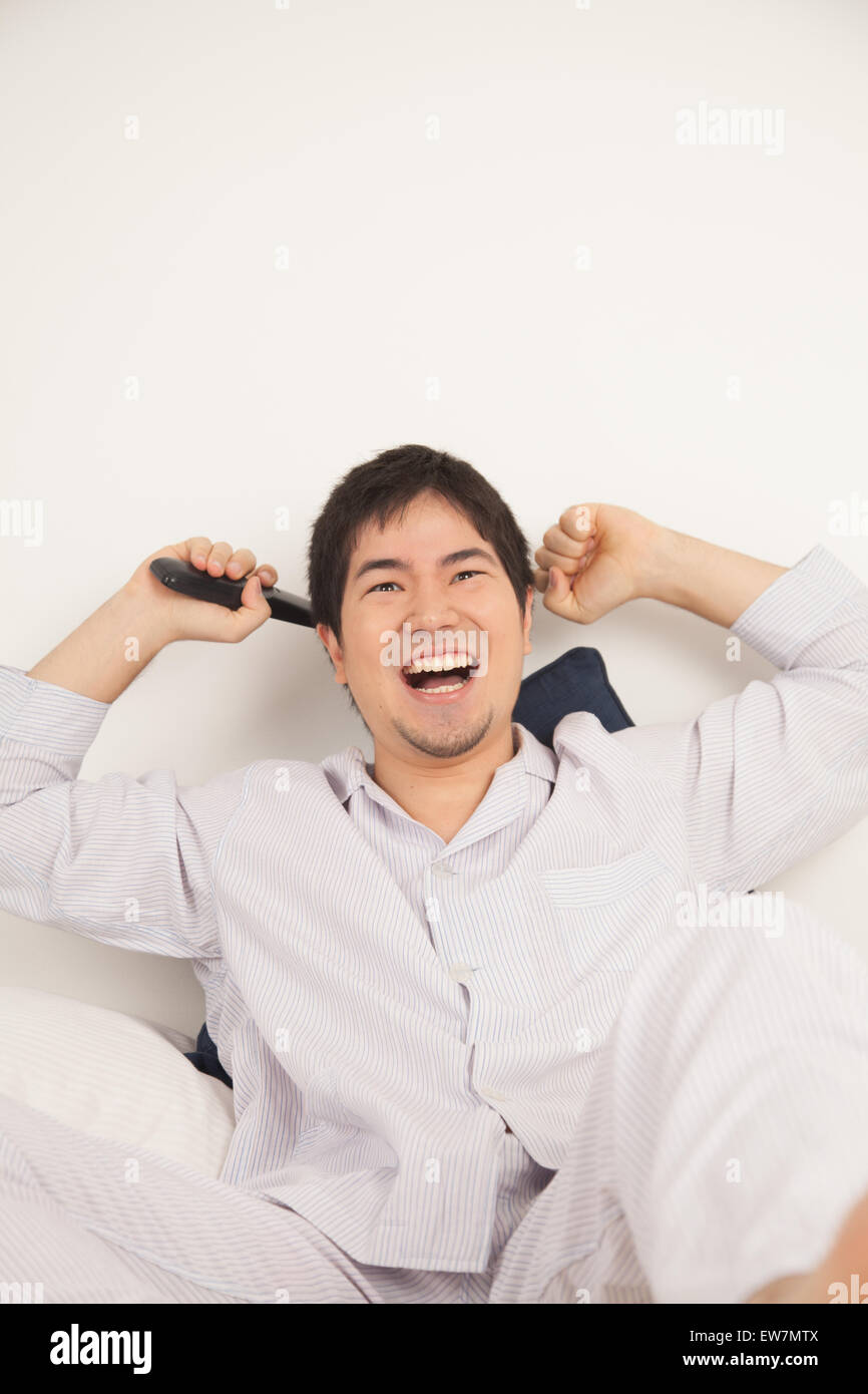 Asian young man celebrating hi-res stock photography and images - Alamy
