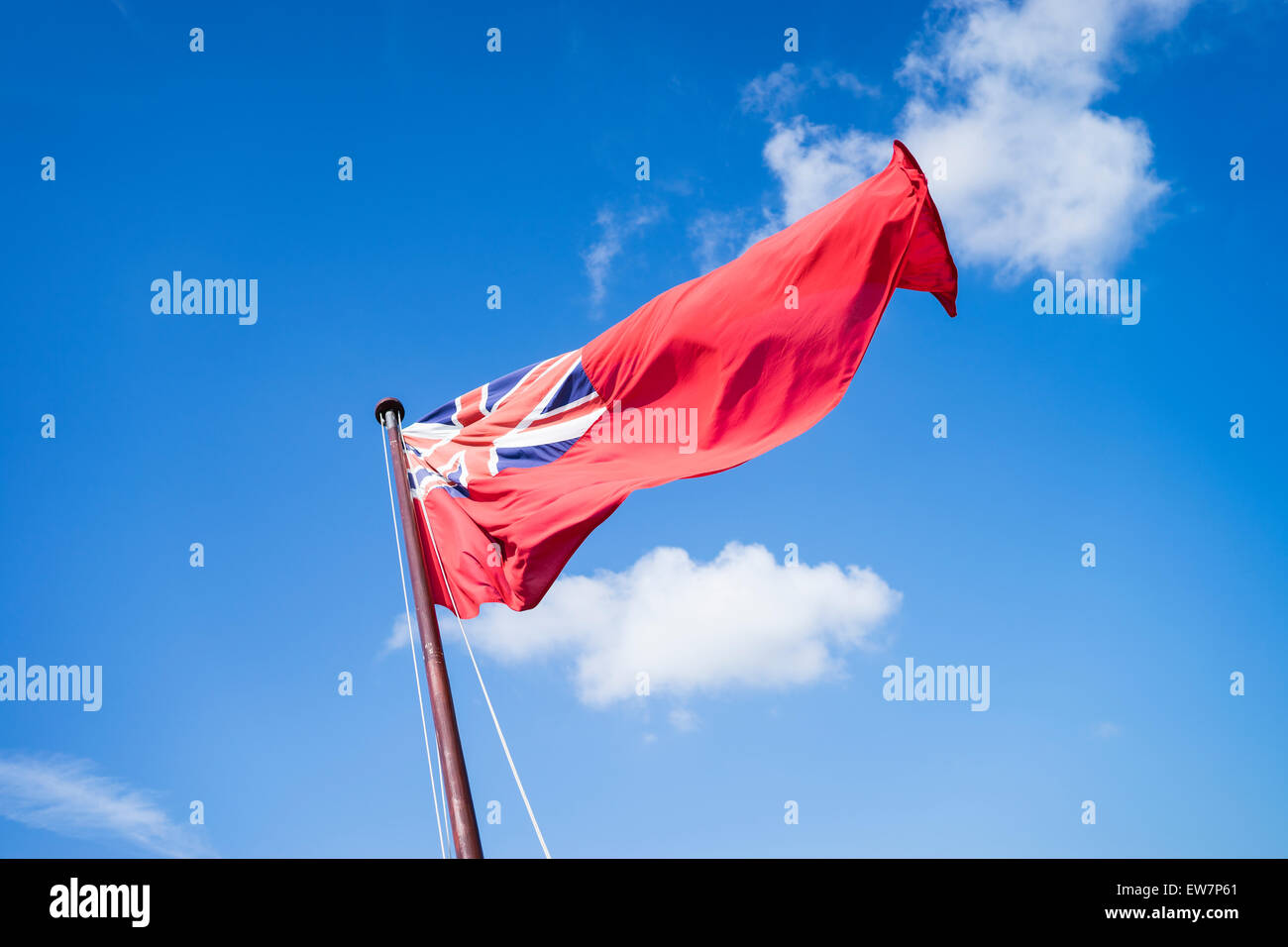 The navy ensign flying from a ship at Portsmouth. Stock Photo
