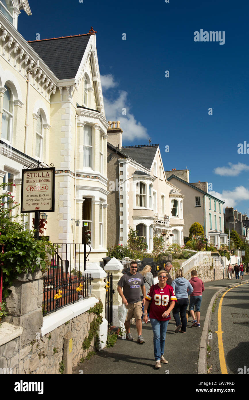 UK, Wales, Conwy, Llandudno, Church Walks, visitors outside Stella Guest House Stock Photo