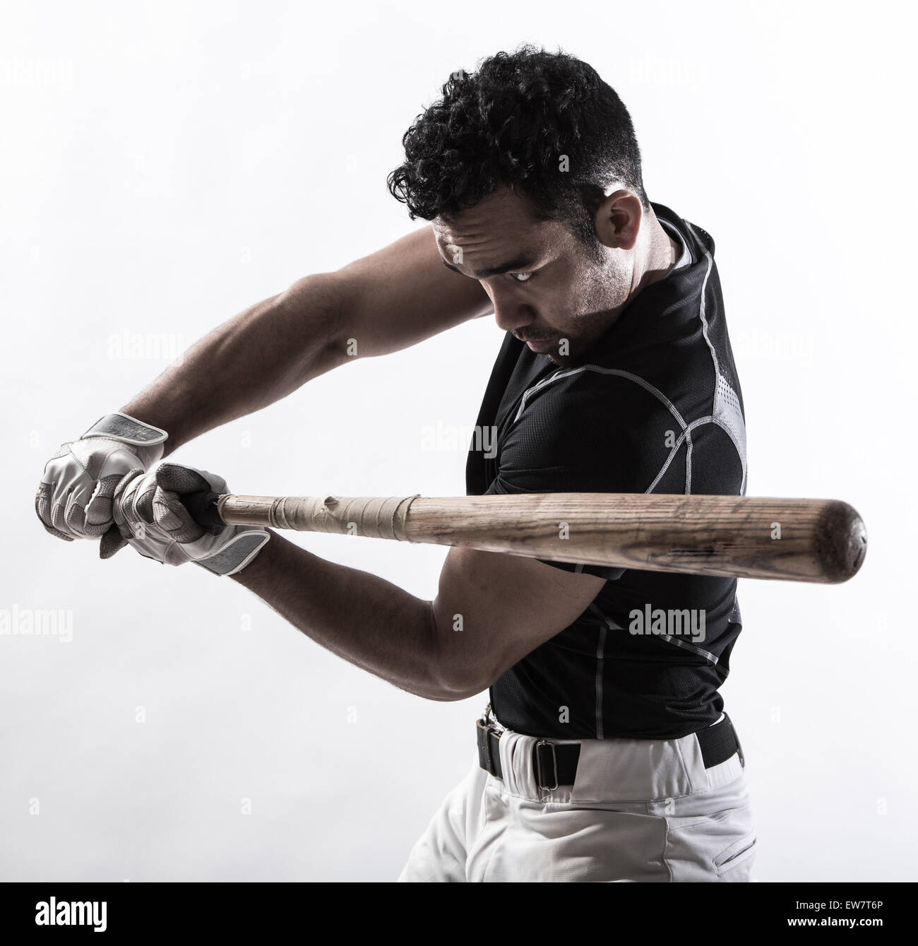 Portrait of a man holding a baseball bat Stock Photo - Alamy