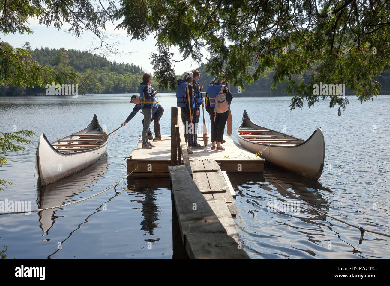 Group going on a canoe ride in a 10 men canoe in Haliburton Highlands