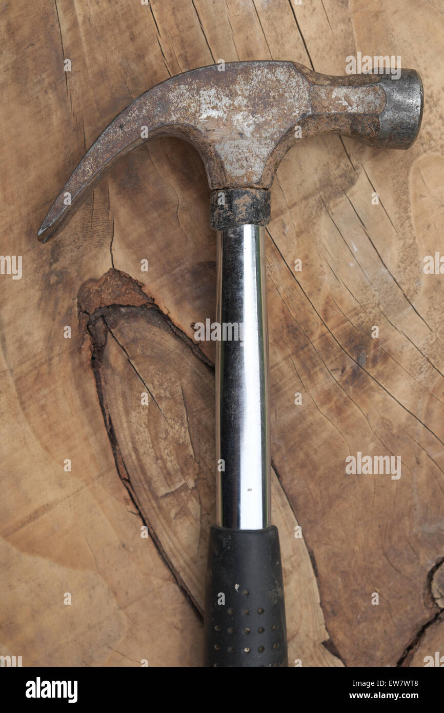 Hammer tool on a wooden background Stock Photo