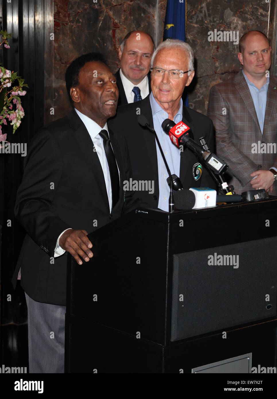 New York Cosmos legends, Pelé and Franz Beckenbauer, light up the Empire State Building in 'Cosmos Green' to celebrate the start of the soccer team's 2015 spring season  Featuring: Pelé, Franz Beckenbauer Where: New York City, New York, United States When: 17 Apr 2015 Stock Photo