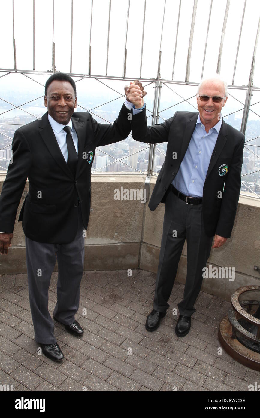 New York Cosmos legends, Pelé and Franz Beckenbauer, light up the Empire State Building in 'Cosmos Green' to celebrate the start of the soccer team's 2015 spring season  Featuring: Pelé, Franz Beckenbauer Where: New York City, New York, United States When: 17 Apr 2015 Stock Photo