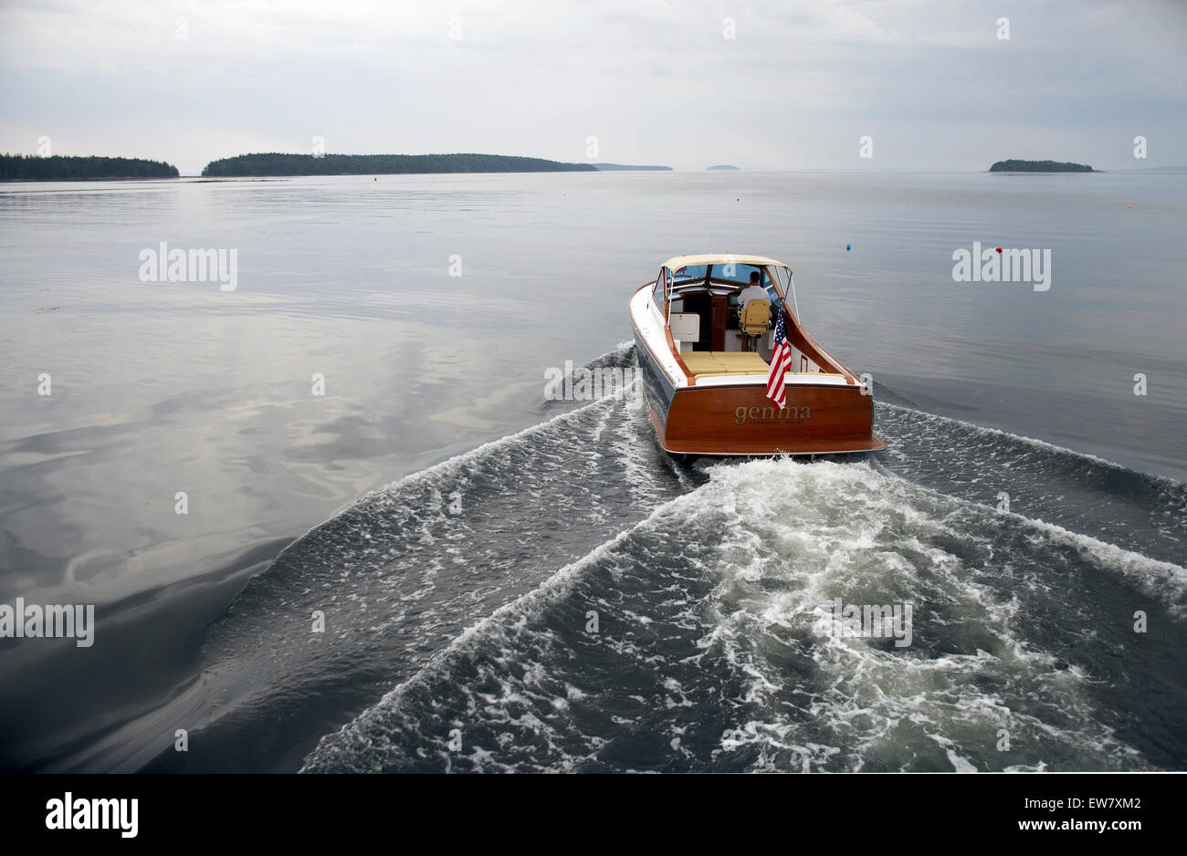 A power boat heads for home on calm seas Stock Photo Alamy