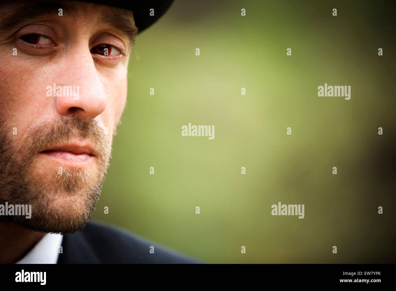 Portrait of a young man looking at the camera Stock Photo - Alamy