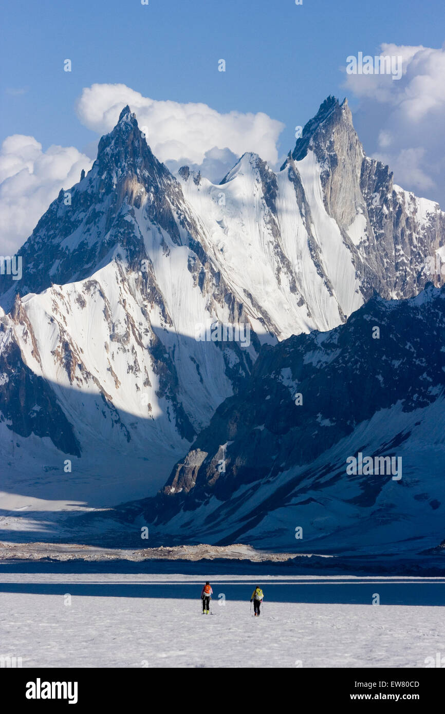 Two women skiing on the Biafo glacier in the Karakoram himalaya in Pakistan Stock Photo