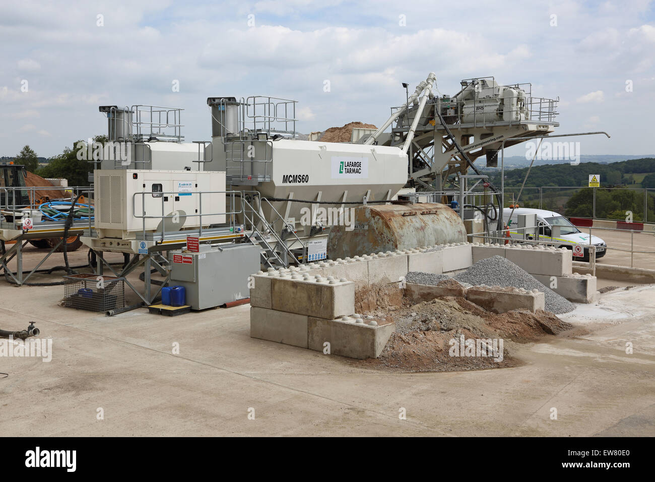 An on-site concrete batching plant on a large rural construction site Stock Photo