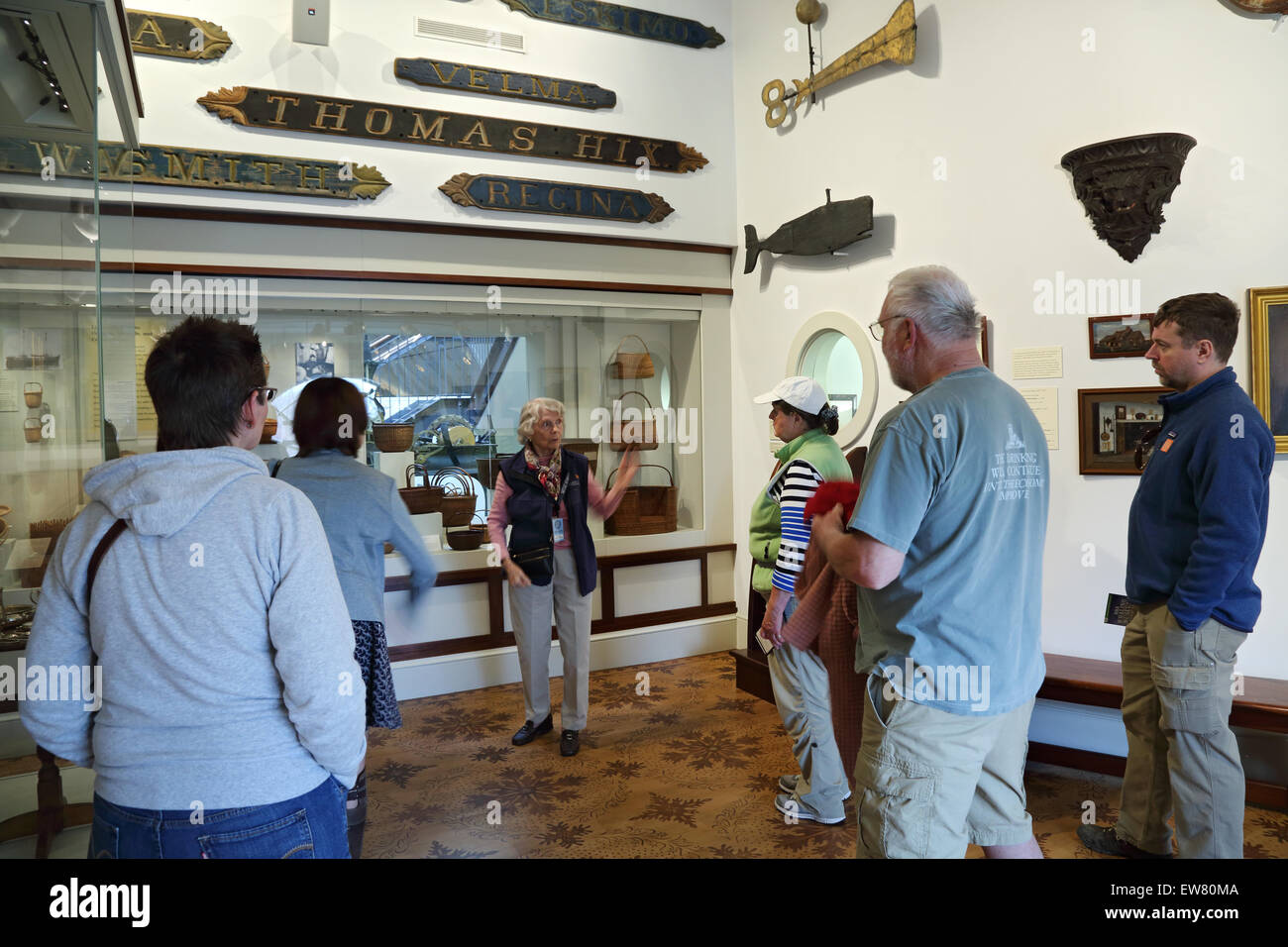 Tour guide gives tour to visitors at the Nantucket Whaling Museum, Nantucket, Massachusetts Stock Photo