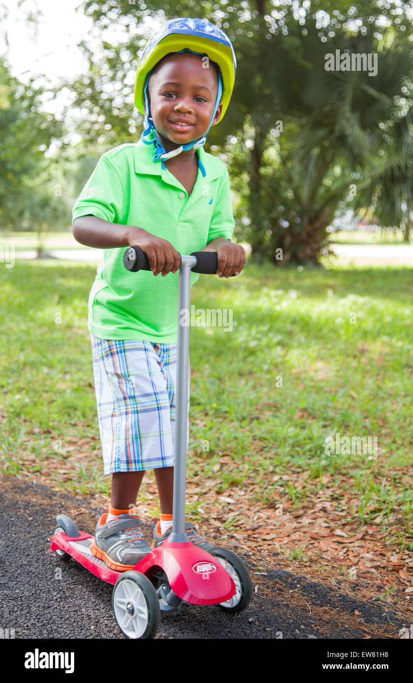 Young African American boy age 4 playing in park in Florida Stock Photo