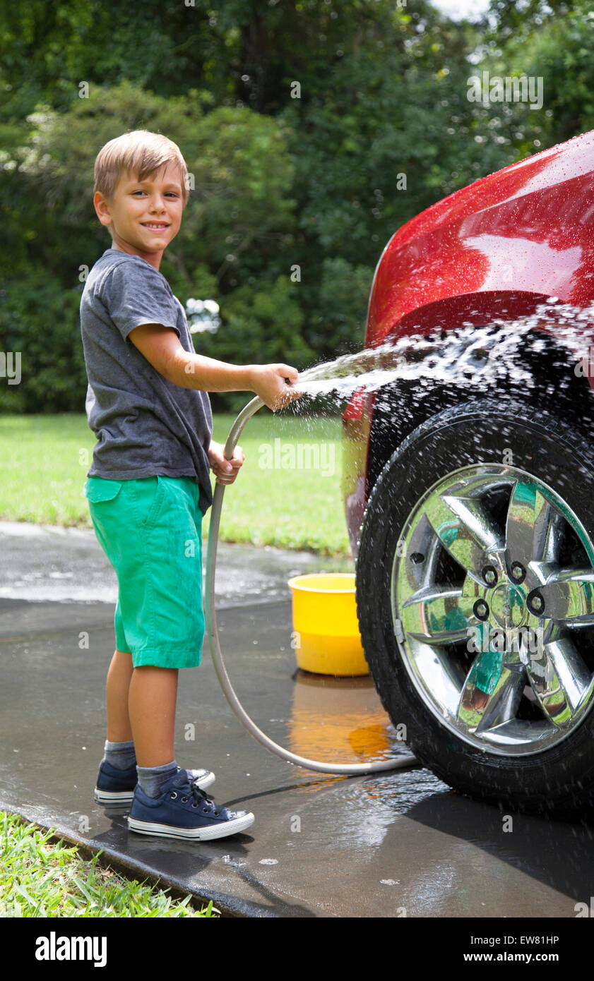 Family washing car together in driveway of home Stock Photo Alamy