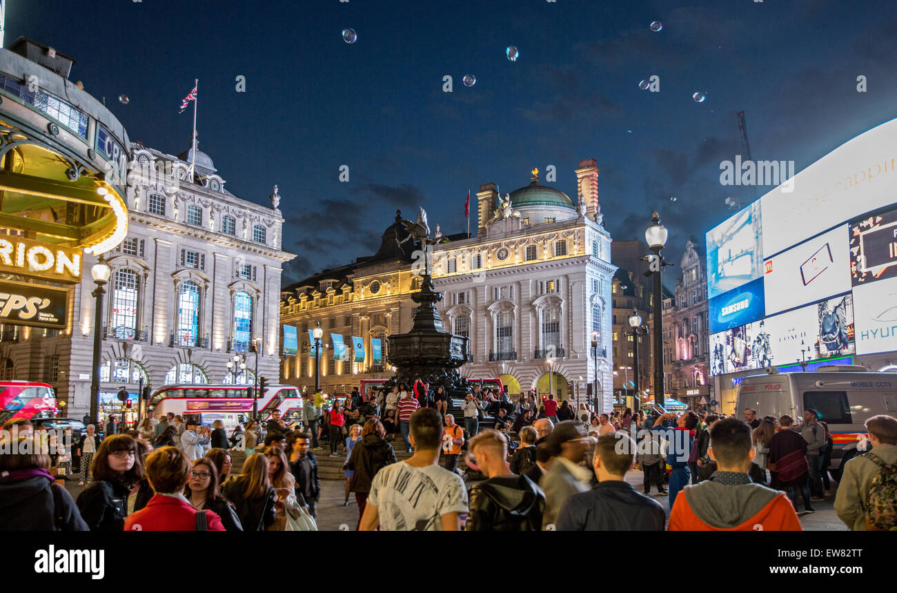 Piccadilly Circus with Eros And Bubbles at Night London UK Stock Photo