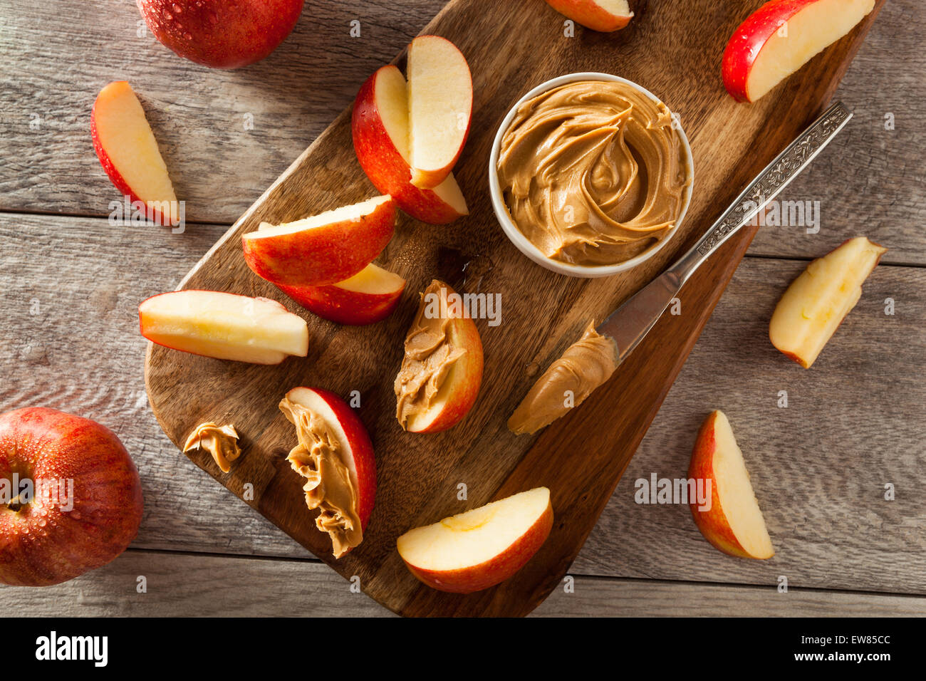 Organic Apples and Peanut Butter to Snack on Stock Photo Alamy