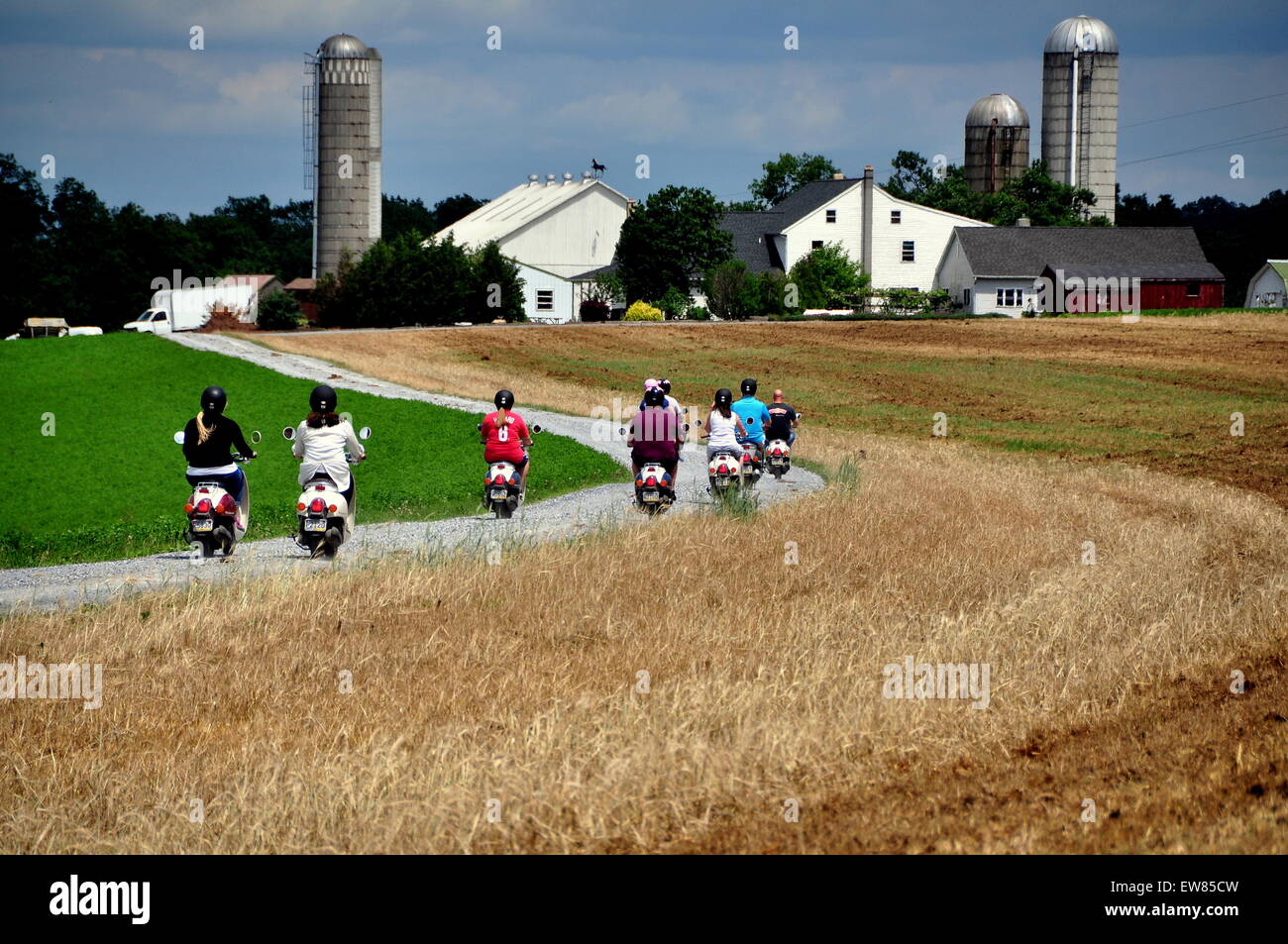 Quarryville, Pennsylvania A group of tourists riding on mopeds follows