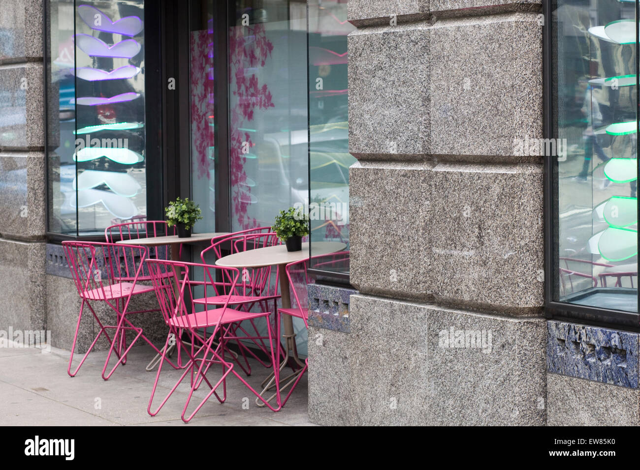 Pink tables and chairs at a café in London england Stock Photo