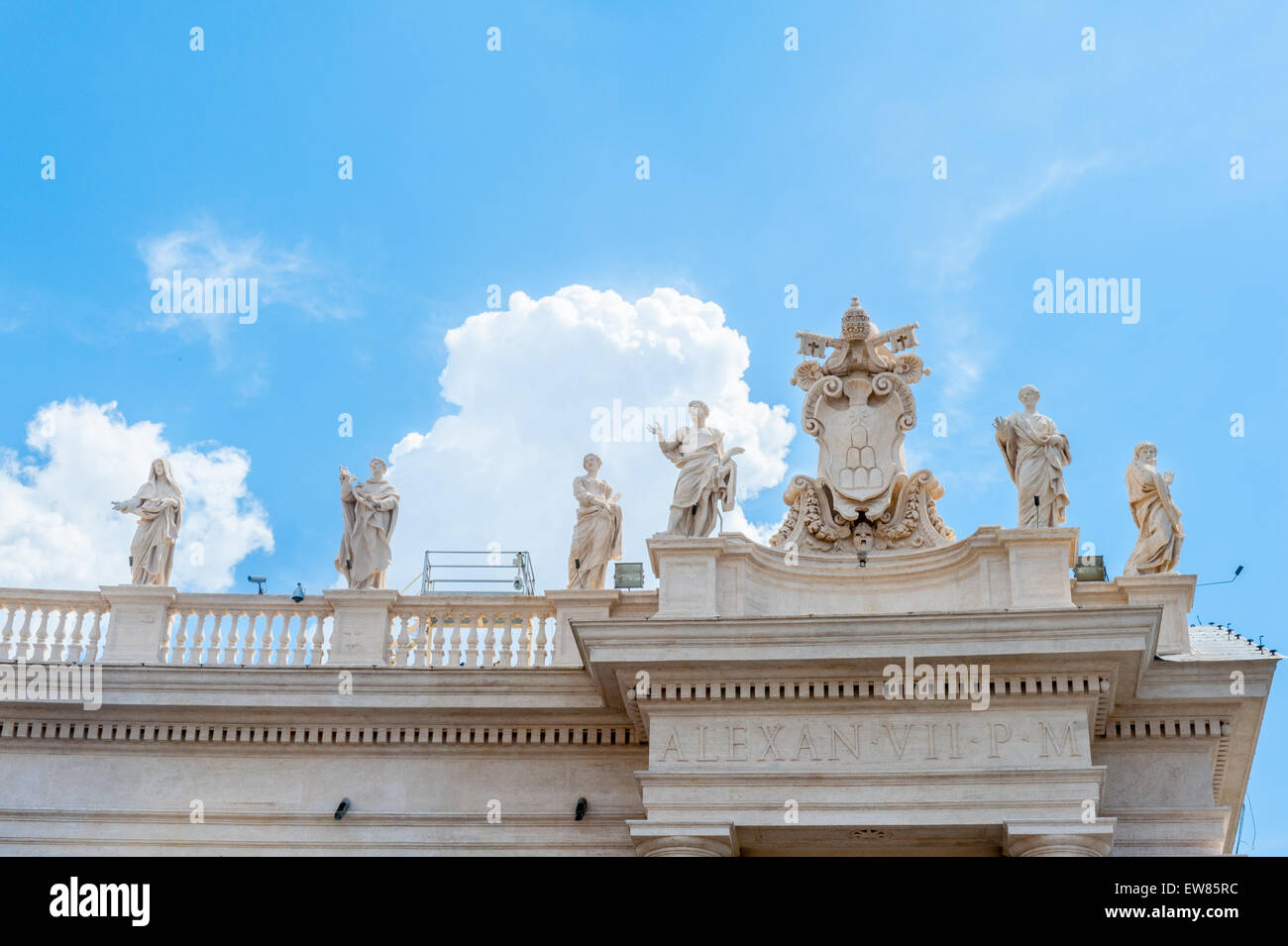 View of St Peter square statue up on Bernini's colonnade, Vatican symbol sunny day Stock Photo