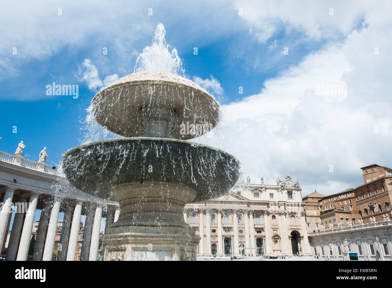 One fountain in St Peter square in Rome, Italy, colonnade and the