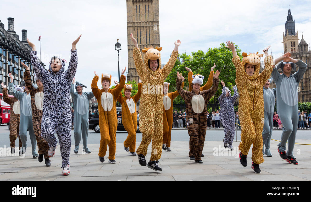 Climate Change activists in animal costumes danced in Parliament Square before a large lobbying event with MPs on climate change at the Houses of Parliament. Stock Photo