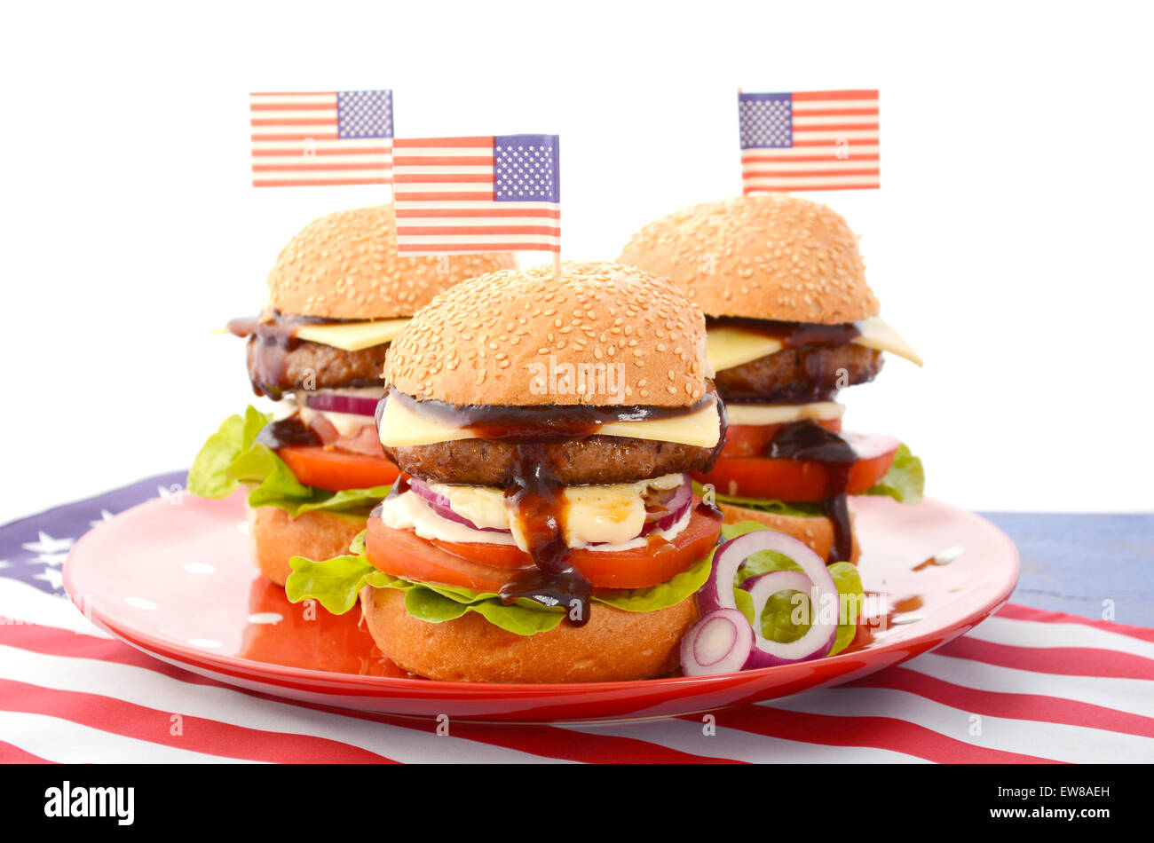 The Great BBQ Hamburger with American flags for USA Fourth of July and holiday events party celebrations. Stock Photo