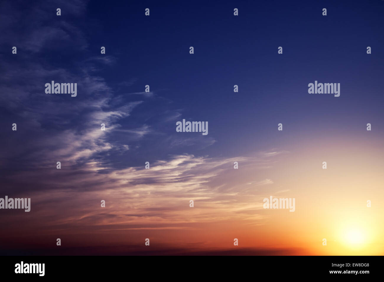 Summer sunset sky with clouds and sun Stock Photo - Alamy