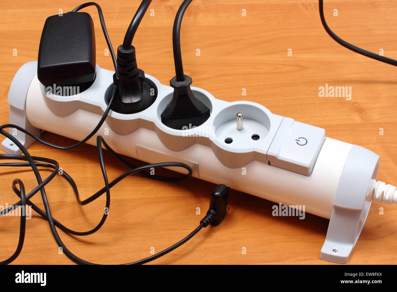 Electrical plugs with cords connected to electrical power strip