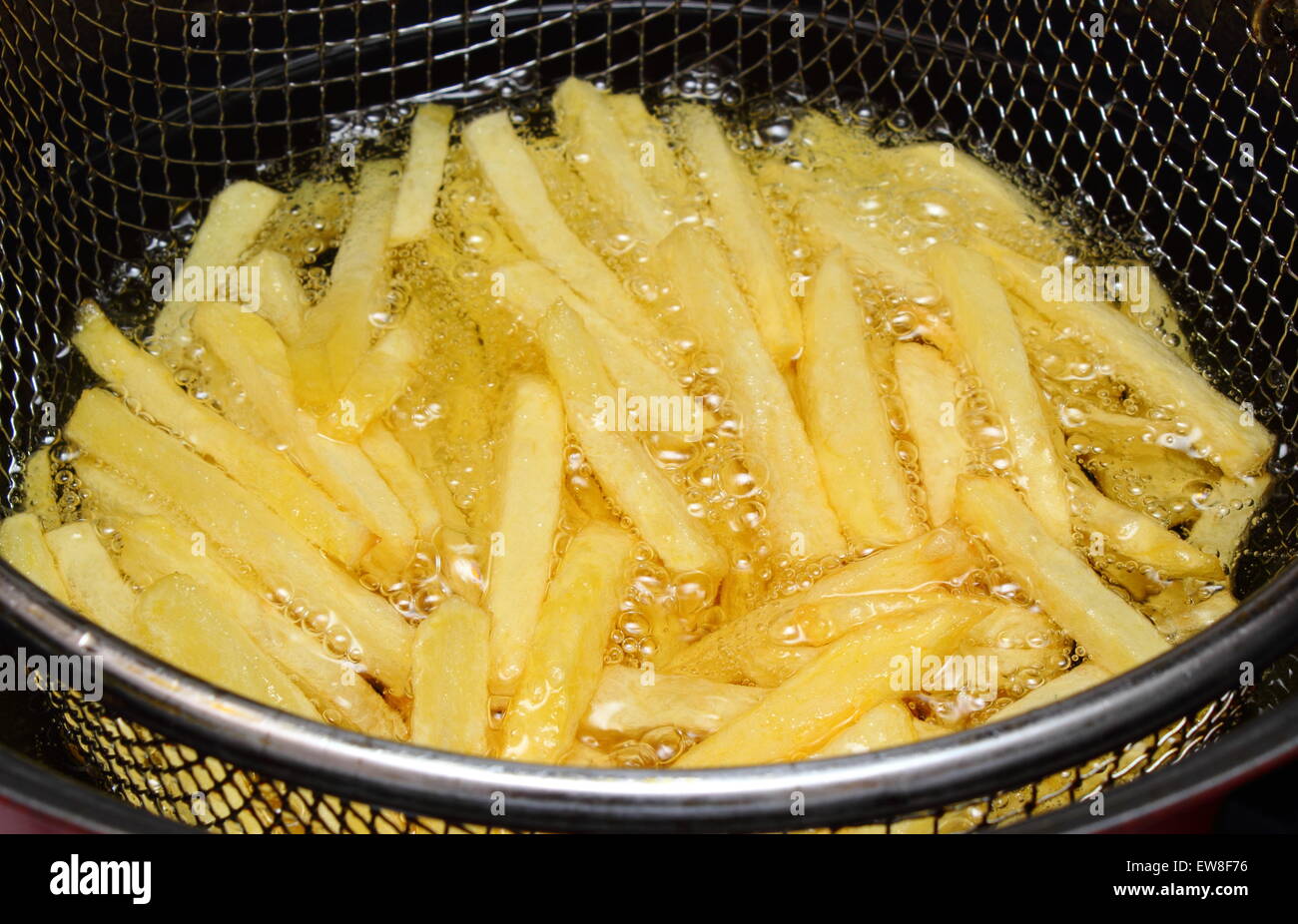 Heap of french fries fried in oil, deep fried, unhealthy and caloric