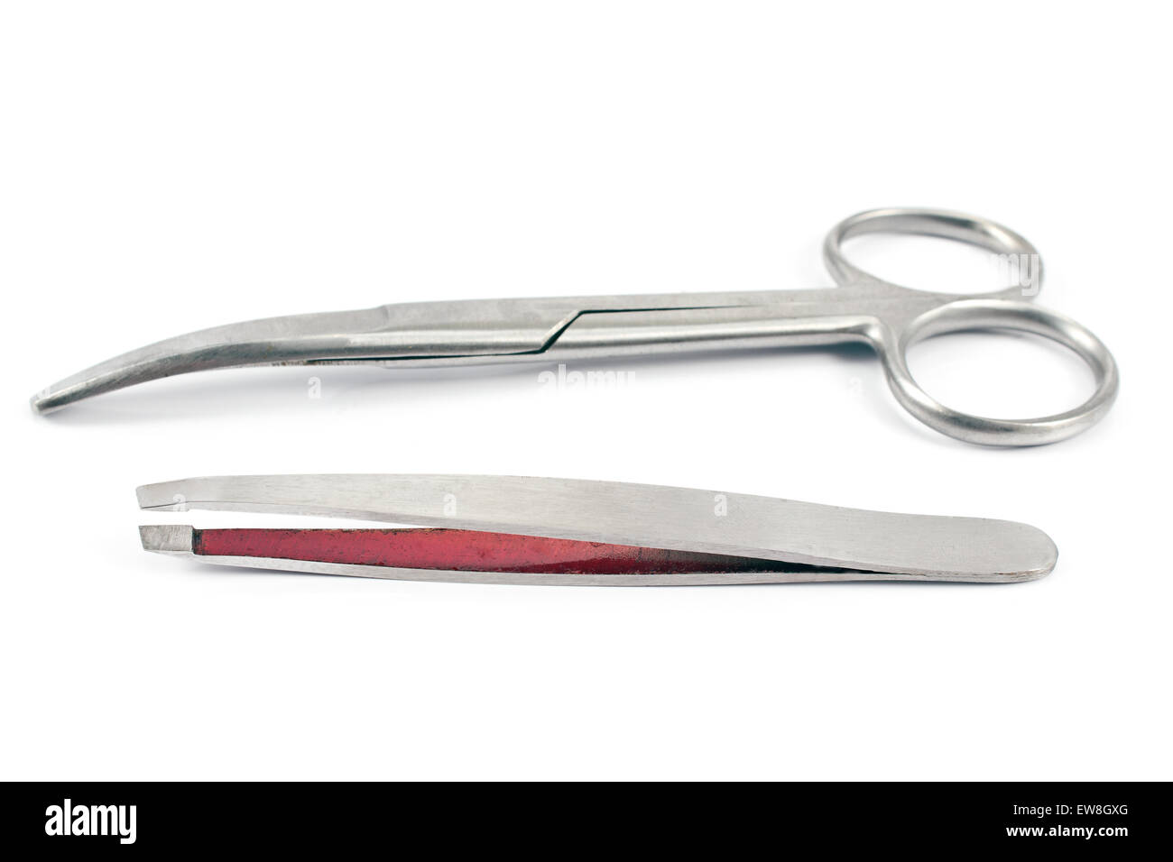 Nail scissors with  eyebrow tweezers isolated on  white Stock Photo