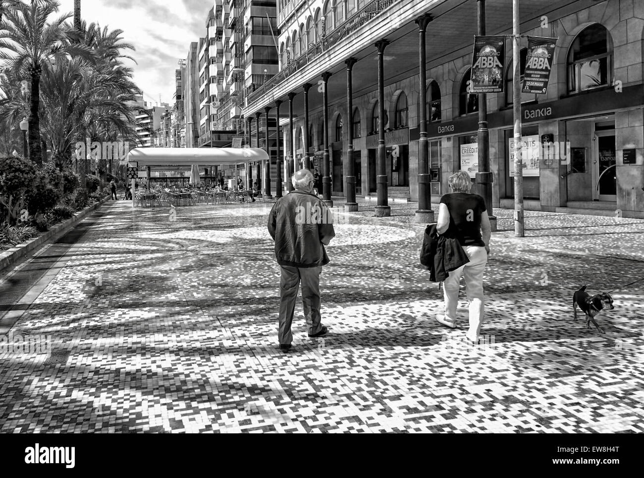 -Couple walking in the street- Alicante (Spain). Stock Photo