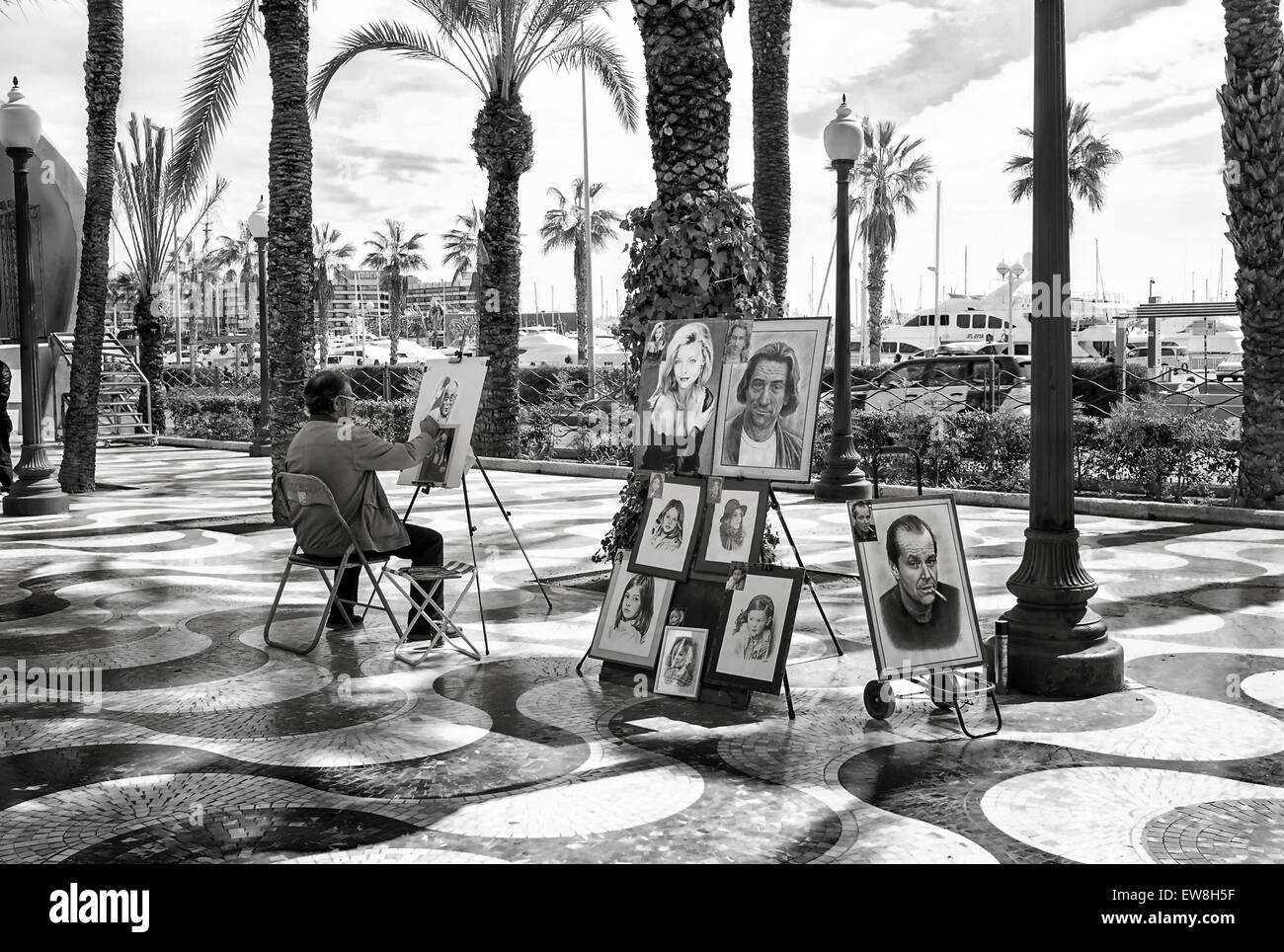 -Artist painting in promenade- Alicante (Spain). Stock Photo