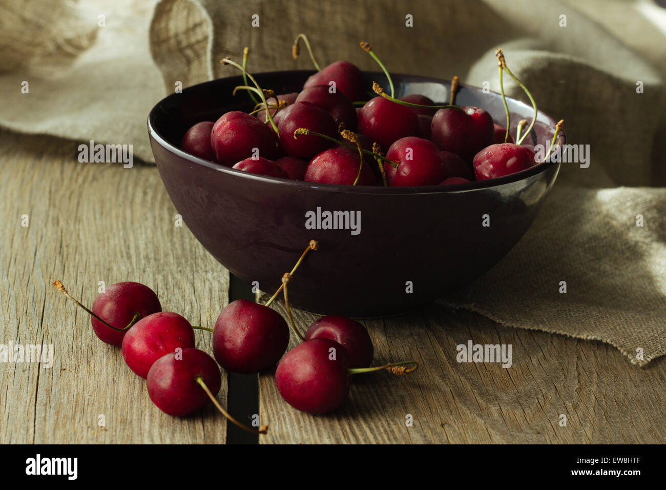 Bowl with black cherry rustic selective focus horizontal Stock Photo