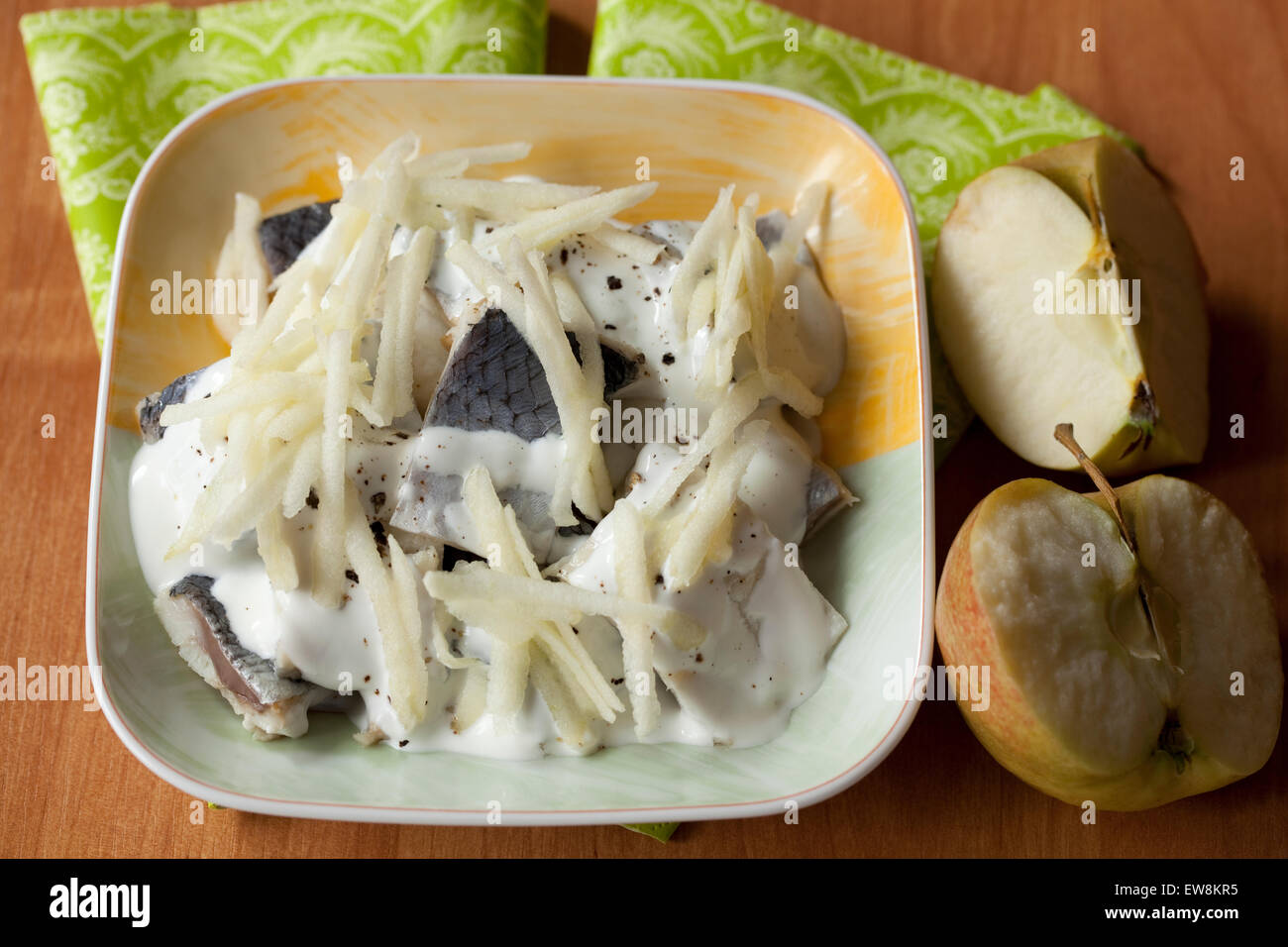 fish filet with apple in cream sauce Stock Photo