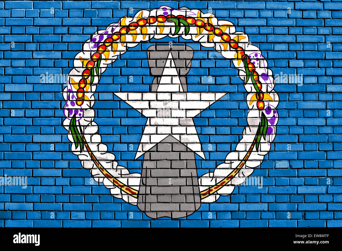 flag of Northern Mariana Islands painted on brick wall Stock Photo