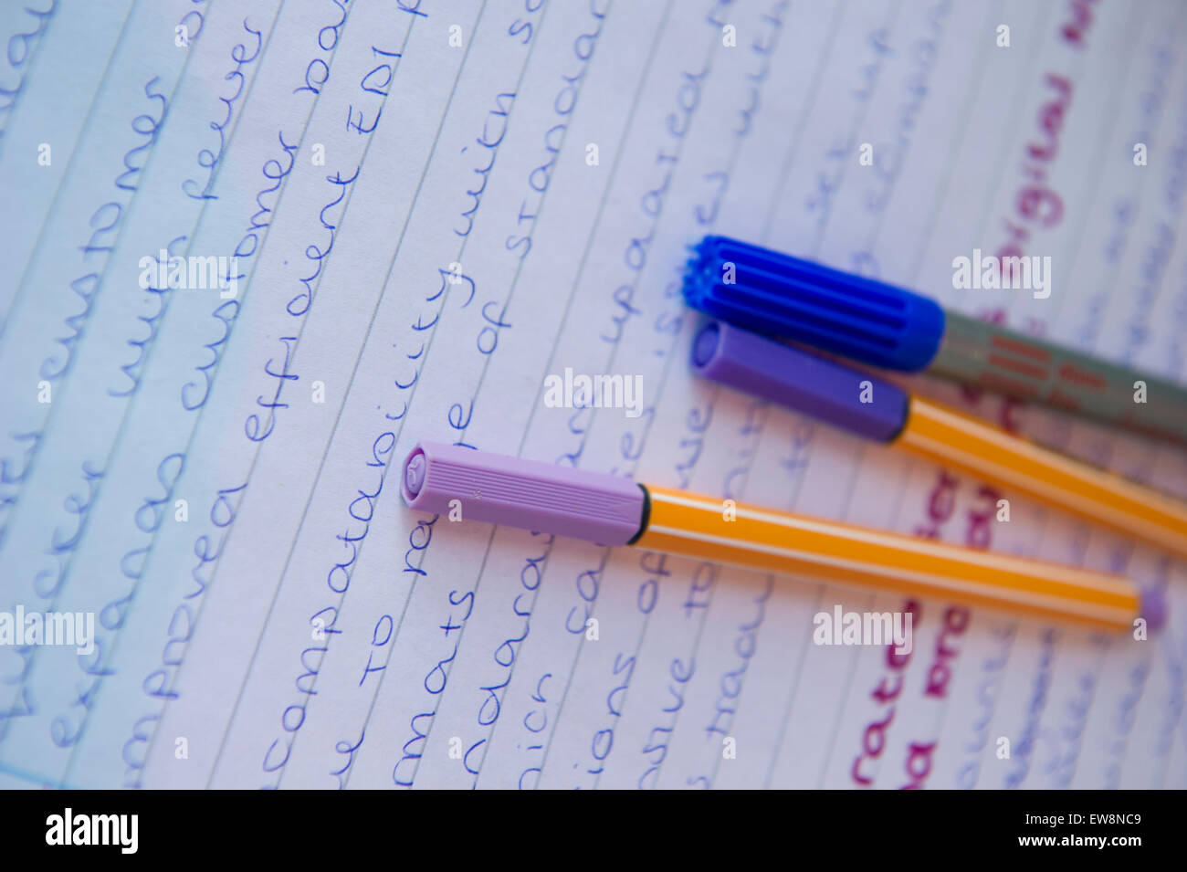 Highlighter pens on A level homework and revision Stock Photo